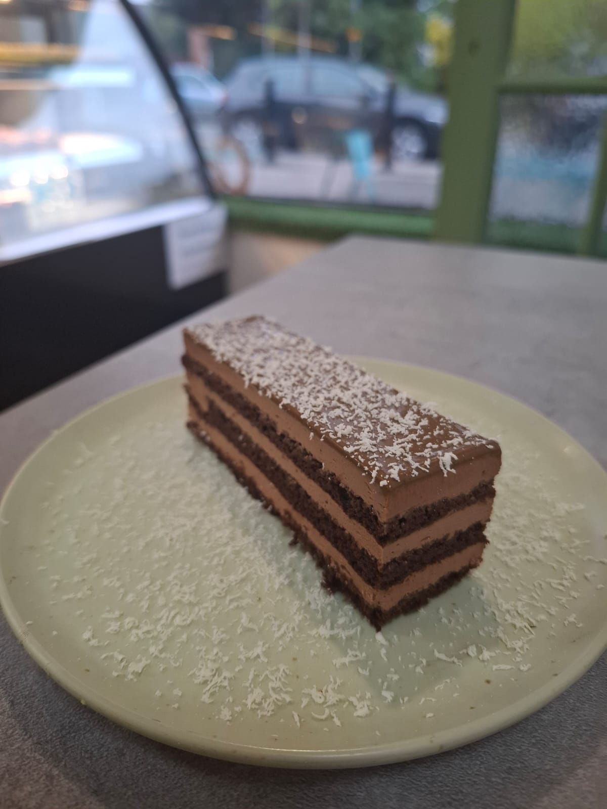 Layered chocolate artisan cake slice at Crookies Bakery
